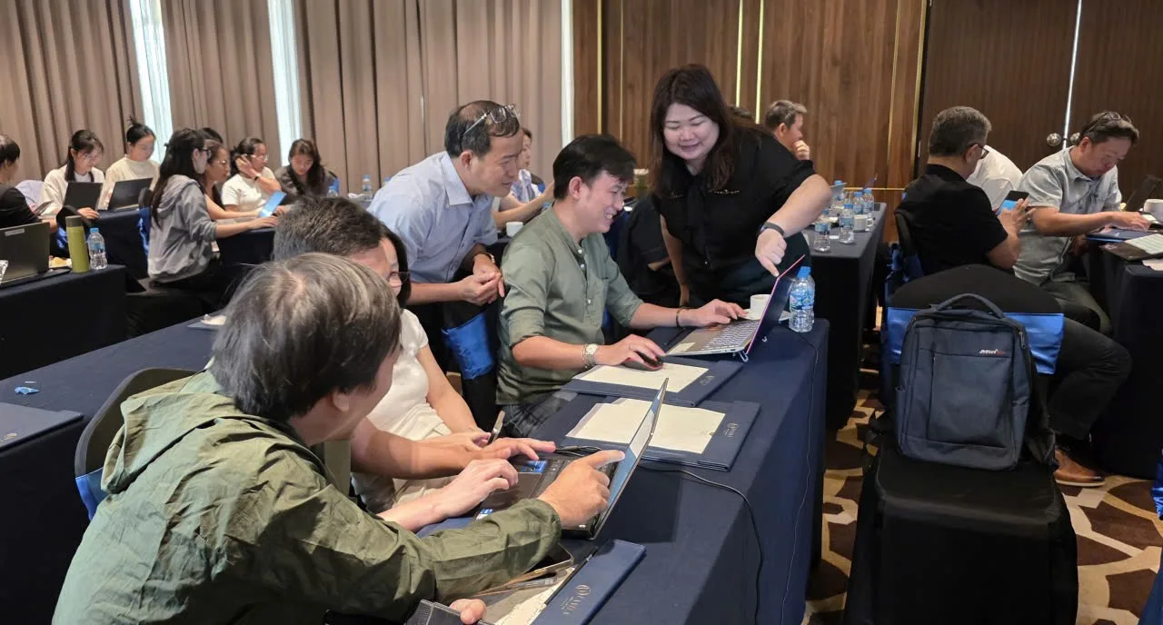 Ashley guiding participants through a hands-on exercise in Vietnam